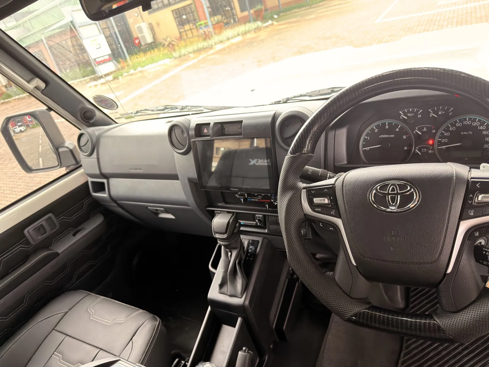 Dashboard with touchscreen head unit and leather trim