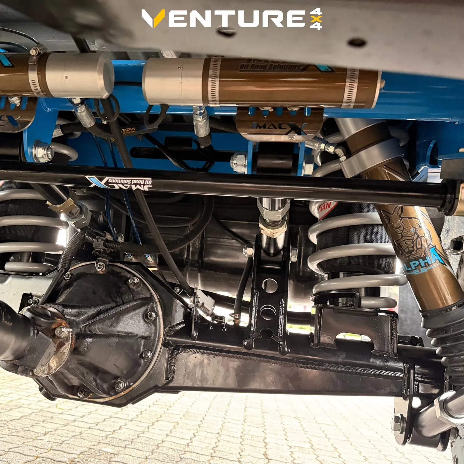JMACX coil-converted rear end with Alpha 2.5 remote-reservoir shocks