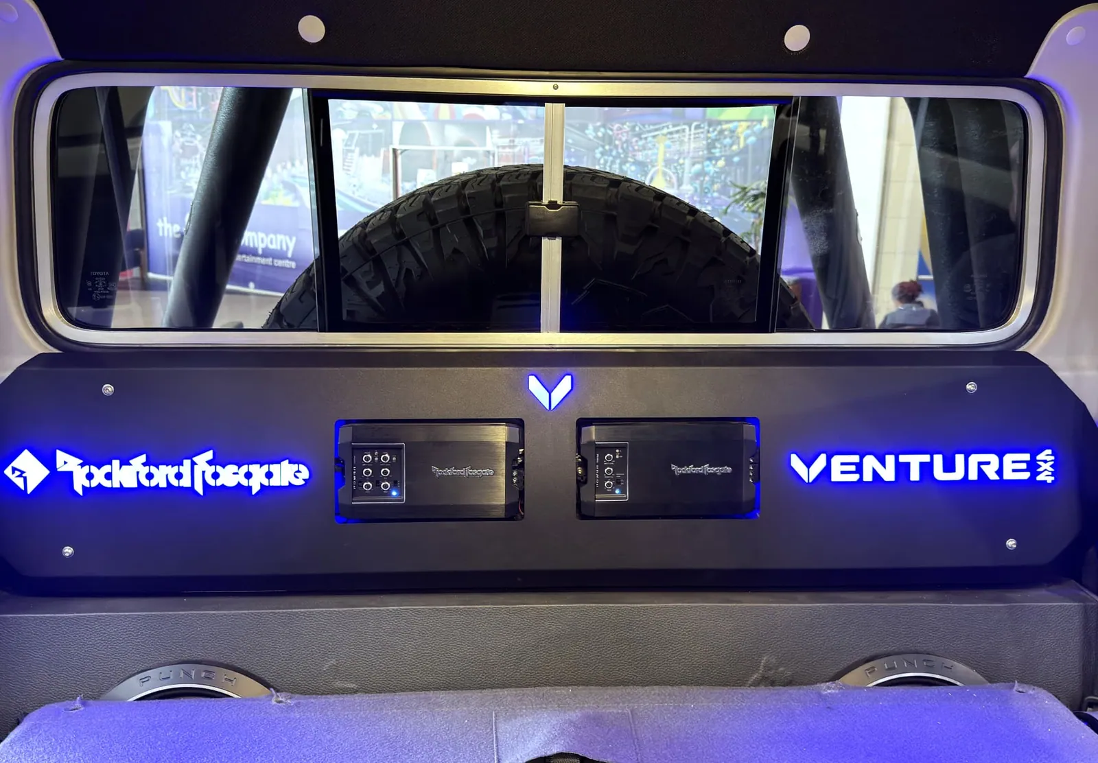 Rockford Fosgate amplifier rack with blue LED backlighting in a Land Cruiser 79