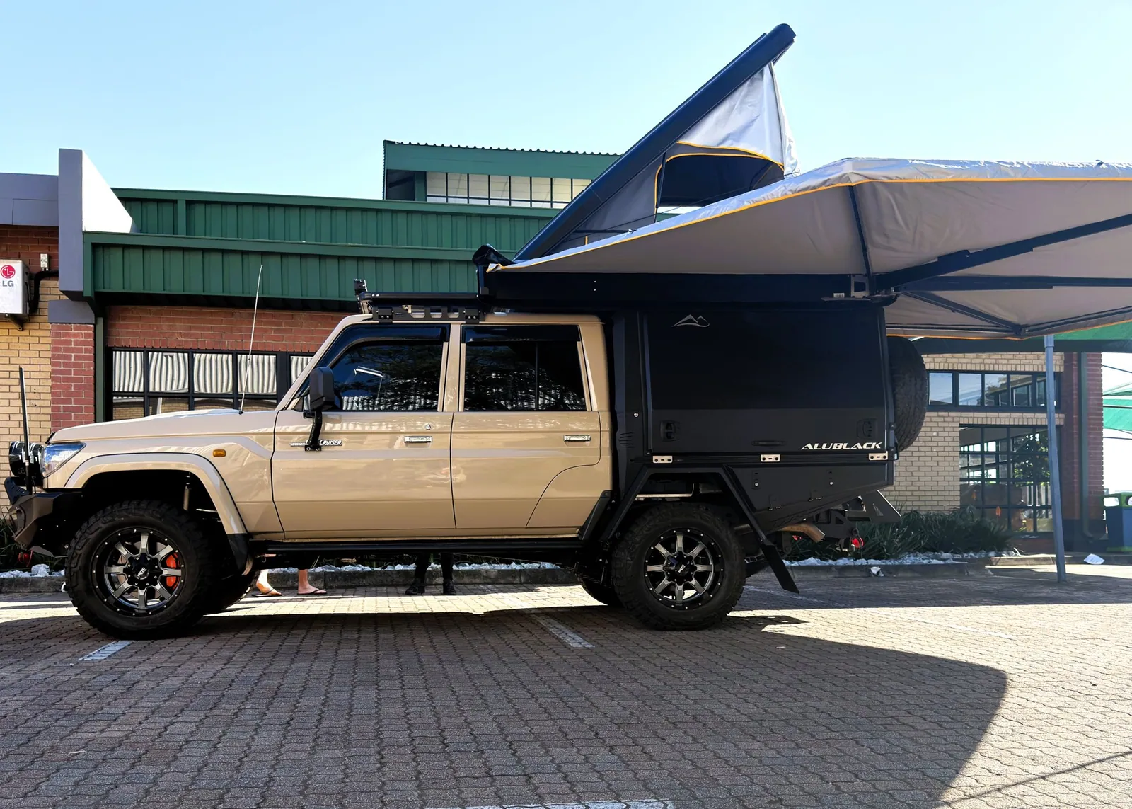 Delta Cruiser — completed touring build with awning out